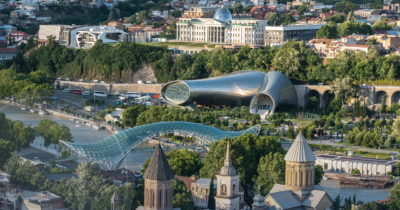 Tbilisi cityscape highlighting modern and historic architecture, representing Georgia's evolving global outlook