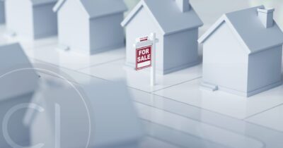 Miniature houses with for sale sign, symbolizing global real estate trends driven by residency and citizenship by investment
